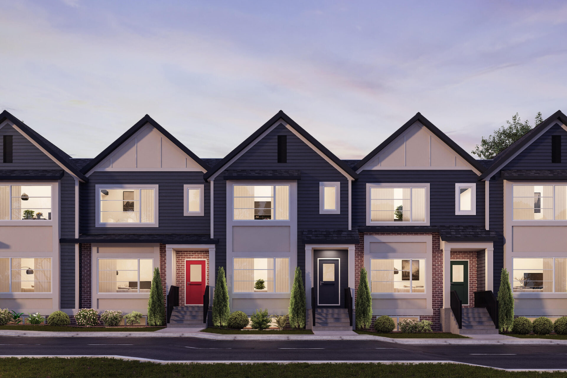 A modern brownstone townhome complex features white window trim and multiple building materials, including siding and brick, to create an interesting streetscape.
